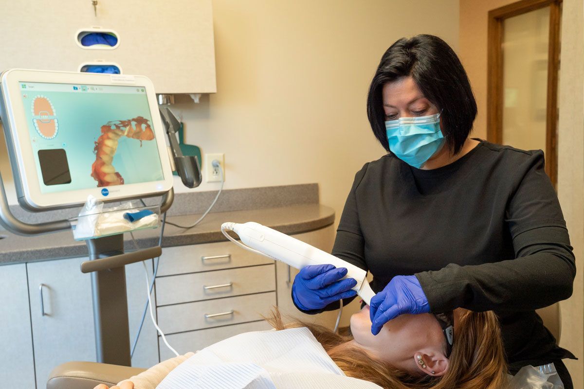 dental-assistant-taking-digital-x-ray-of-patients-teeth