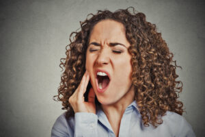 woman with toothache root canal concept
